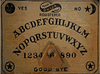 a ouija board that slowly spells out 'help'